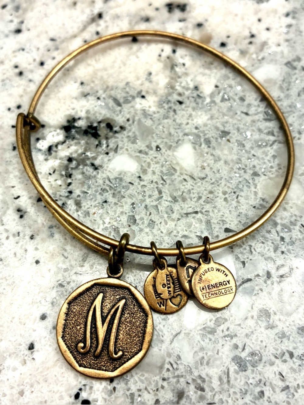 Preowned Alex and Ani gold tone bracelet M charm